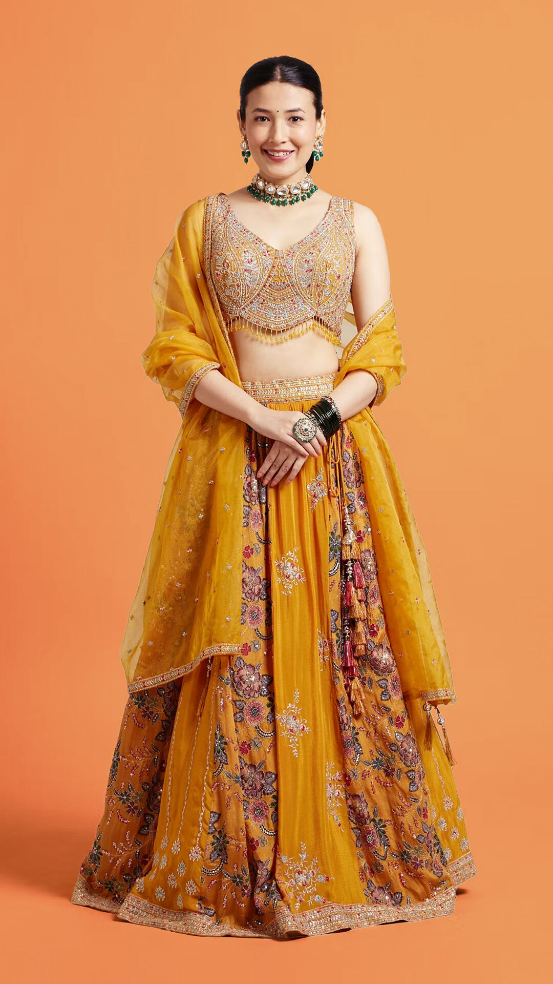 Women wearing pastal lehenga with Embroidery work on it for winter wedding